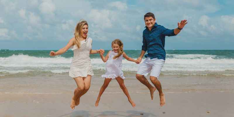 Family Jumping on the Beach